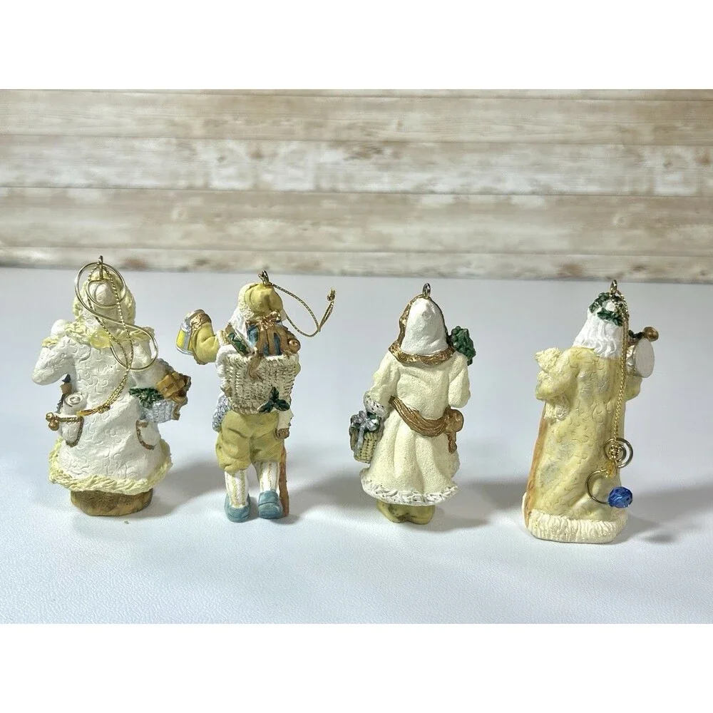 Lot of 4 Santa Figures Christmas Ornaments White Cream Gold Coats Decor